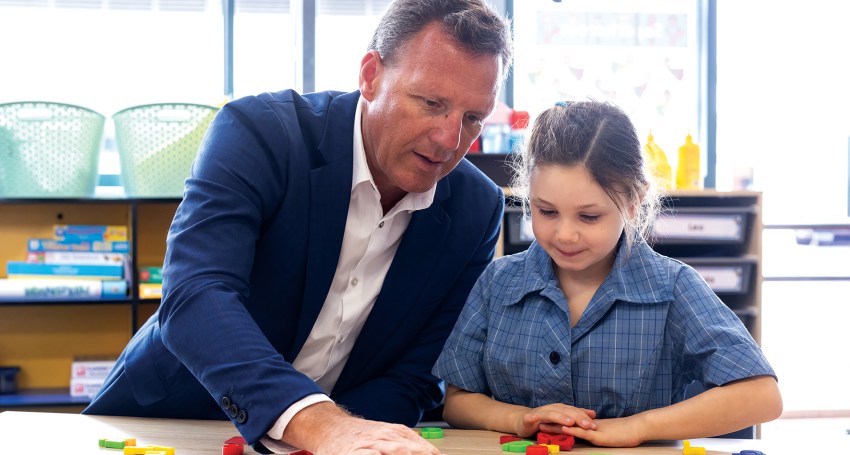 Christ the King School principal Matt Perry and Year 1 student Zara.