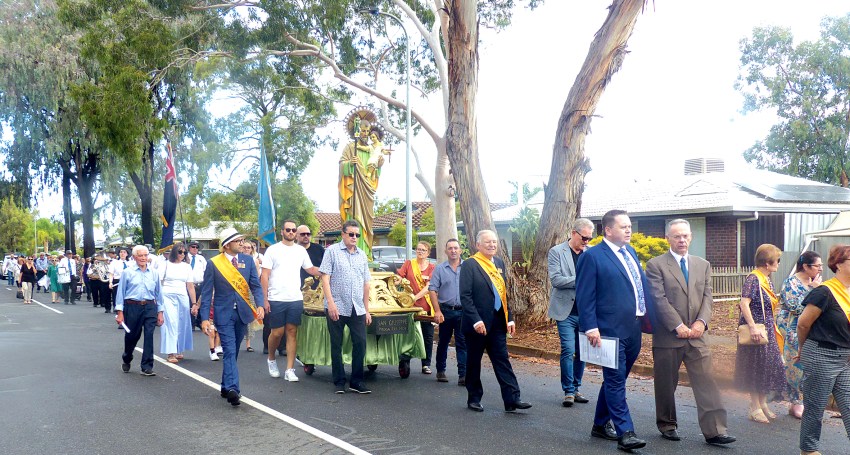 Members of the community taking part in the street procession in Salisbury.