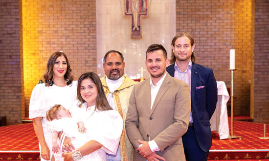 Rosalie Mira Sloan was baptised in St Francis of Assisi Church, Newton by Fr Anthoni Adimai SdM on March 3. Baby Rosalie is held by godmother Elizabeth alongside godfather Dimitri Sarris. Back, from left, mum Priscilla, Fr Anthoni Adimai and dad Paul Sloan.