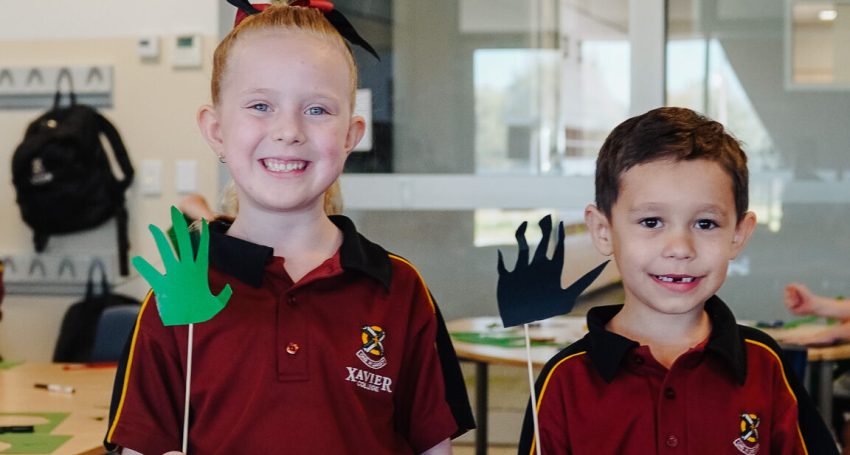 Xavier College students Ayla and Sebastian with their creations.