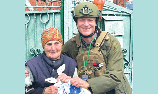 An elderly woman in war-torn Ukraine receives support from a local charity.