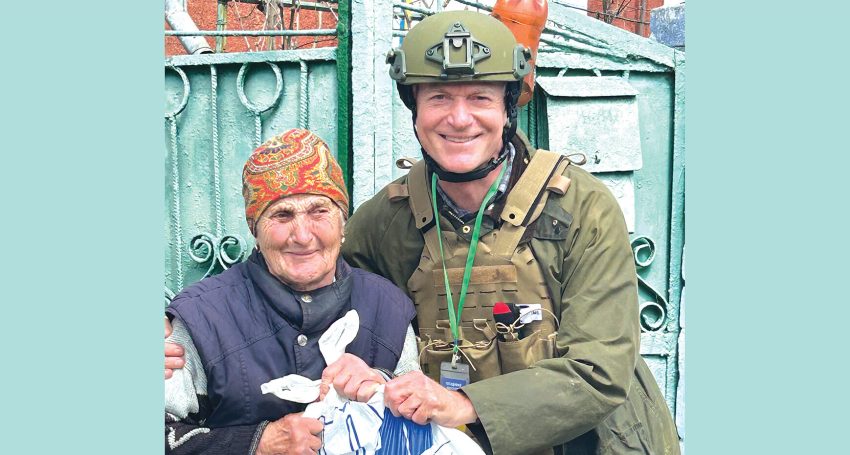 An elderly woman in war-torn Ukraine receives support from a local charity.