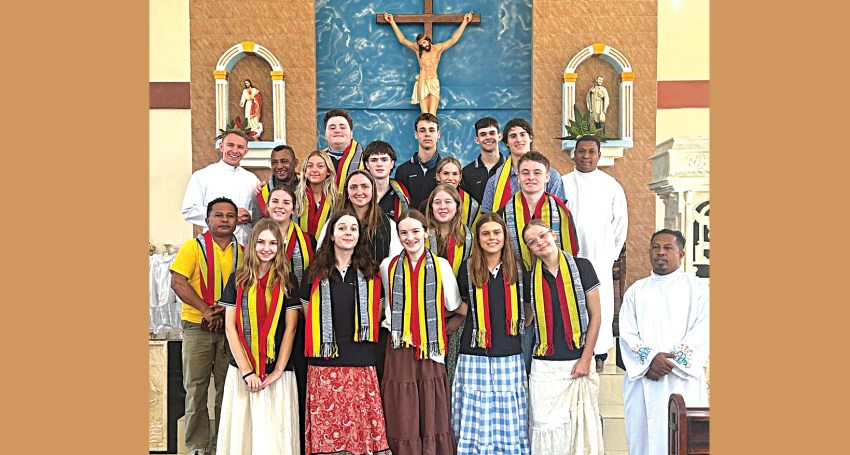 Fr Stirrat (back left) with Tenison Woods College students during their immersion trip to Timor-Leste.