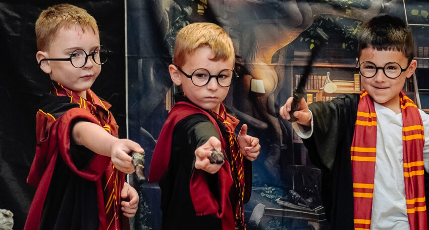 Xavier College students Connor, Nixon and Matthew dress up for Book Week.