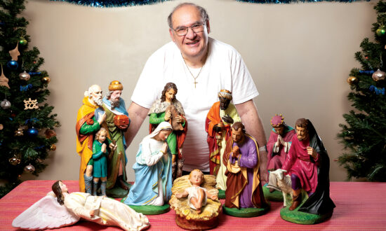 Fr Fred Farrugia with the nativity set he spent months repairing and painting ahead of Christmas. Picture: Ben Macmahon