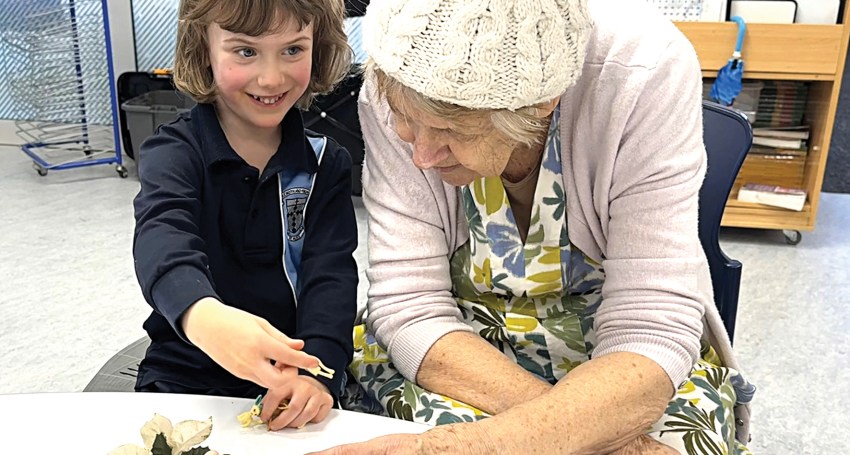 St Pius X student Lucy with resident Lynn Venning.