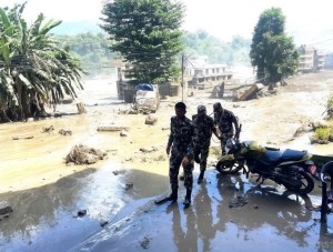 Responders among the damage of the flash flooding. Picture: CRS Nepal